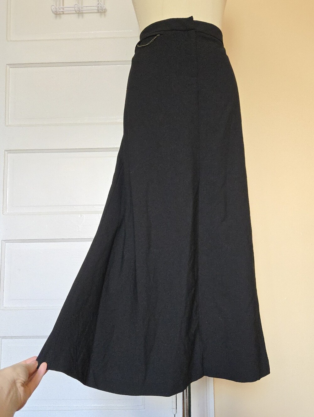 Black wool maxi skirt with small chain zipper pocket